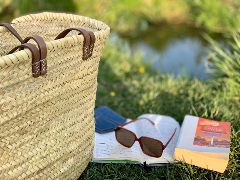 brown woven bag on green grass field